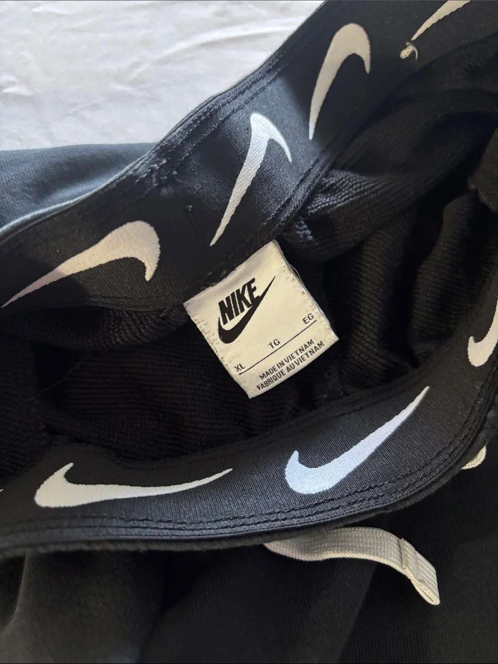 Nike Black Jogger Sweatpants with White Swoosh Graphics
